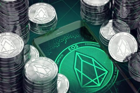 EOS-stacked-coins-with-green-background-of-EOS-logo.